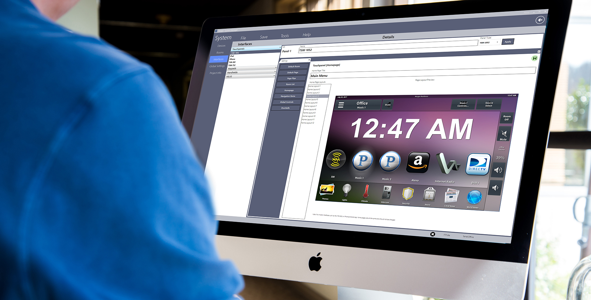 Man using Adapt System Manager application on iMac